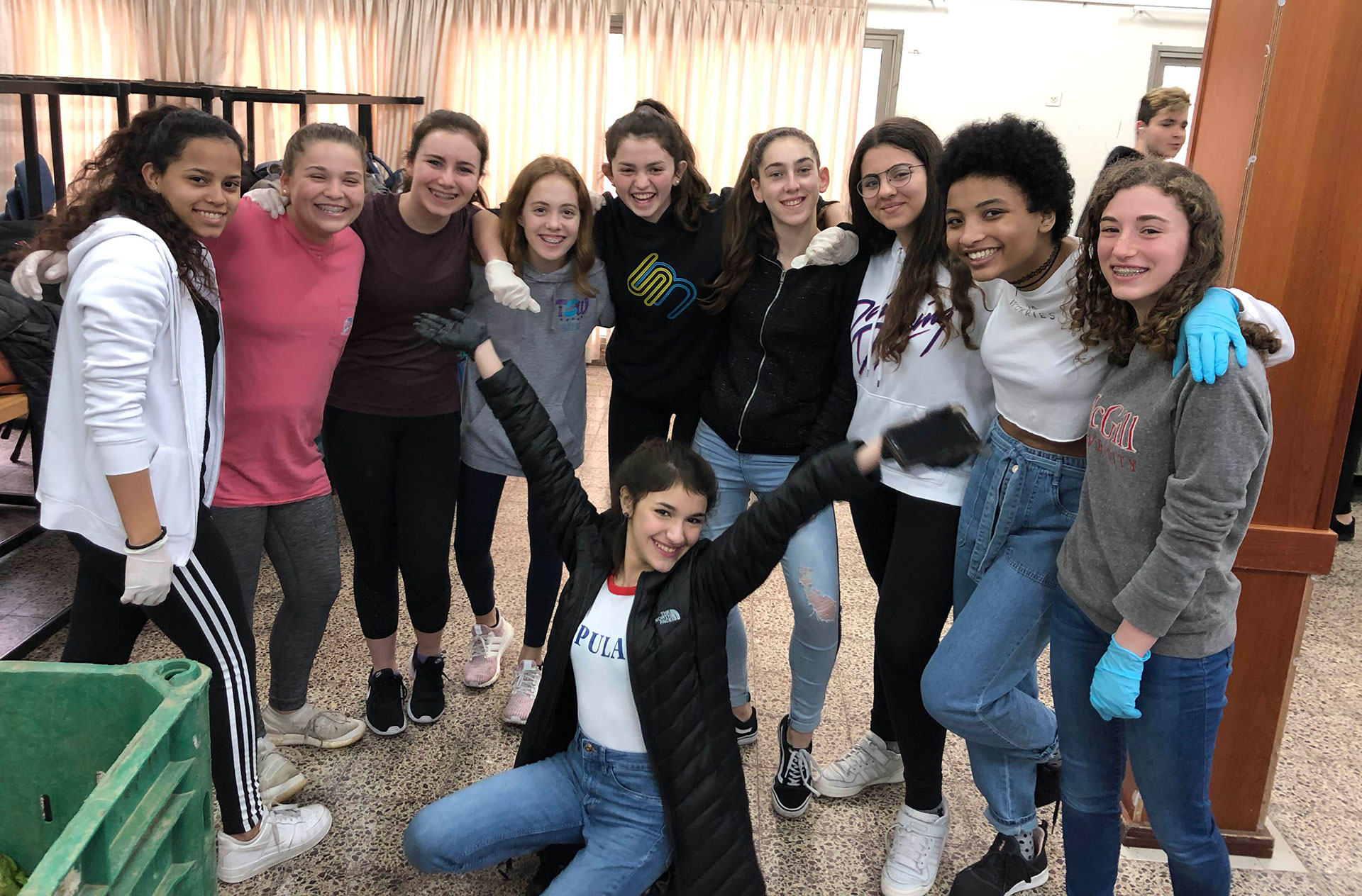 A group of Israeli and American girls pose for a group photo.