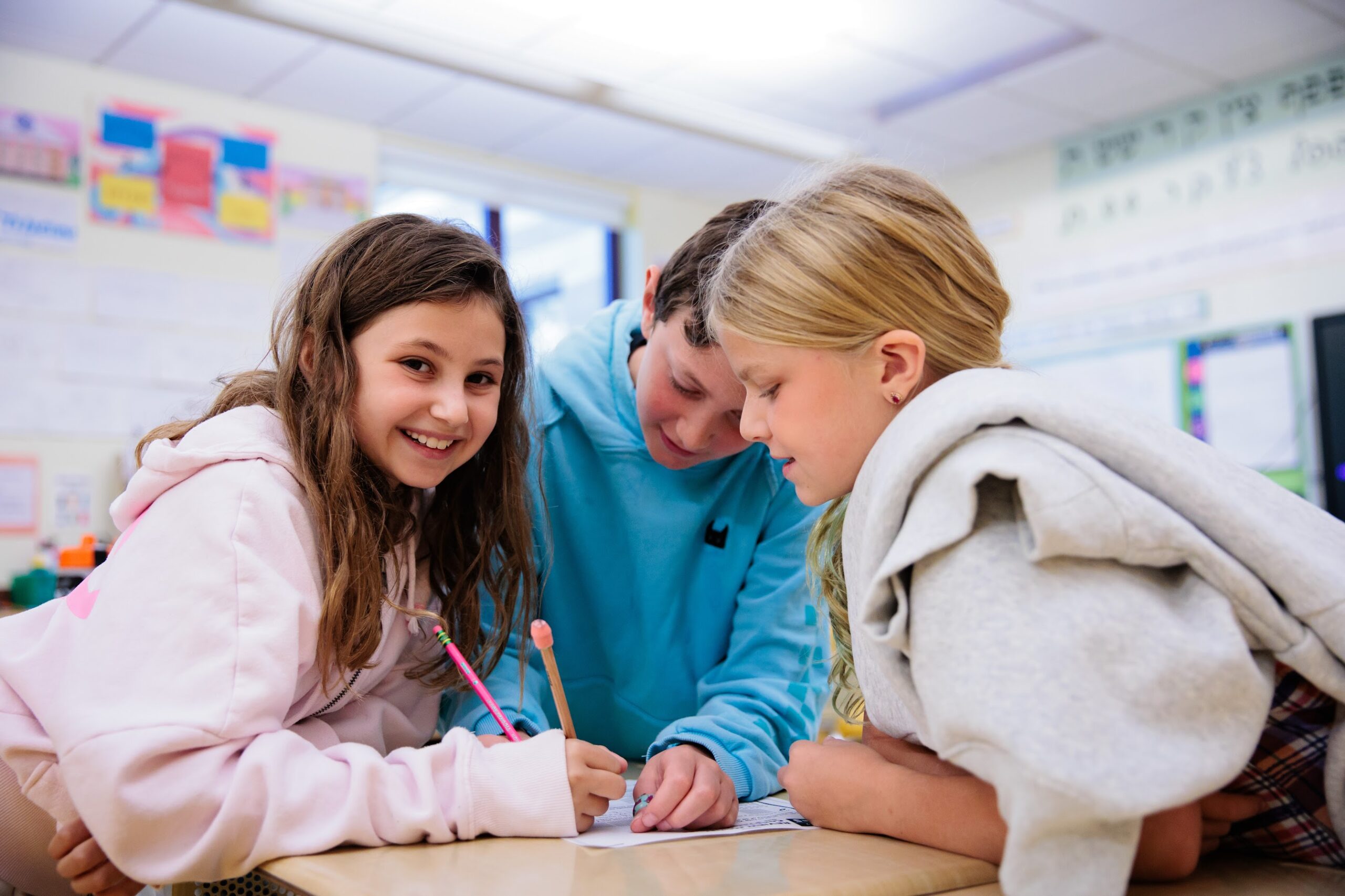 Three Grade 5 students working together