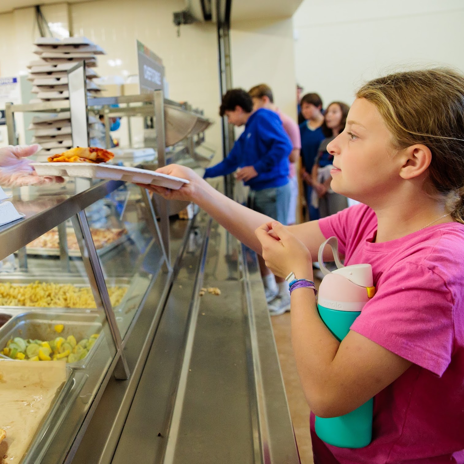 student enjoying a pressed cafe lunch